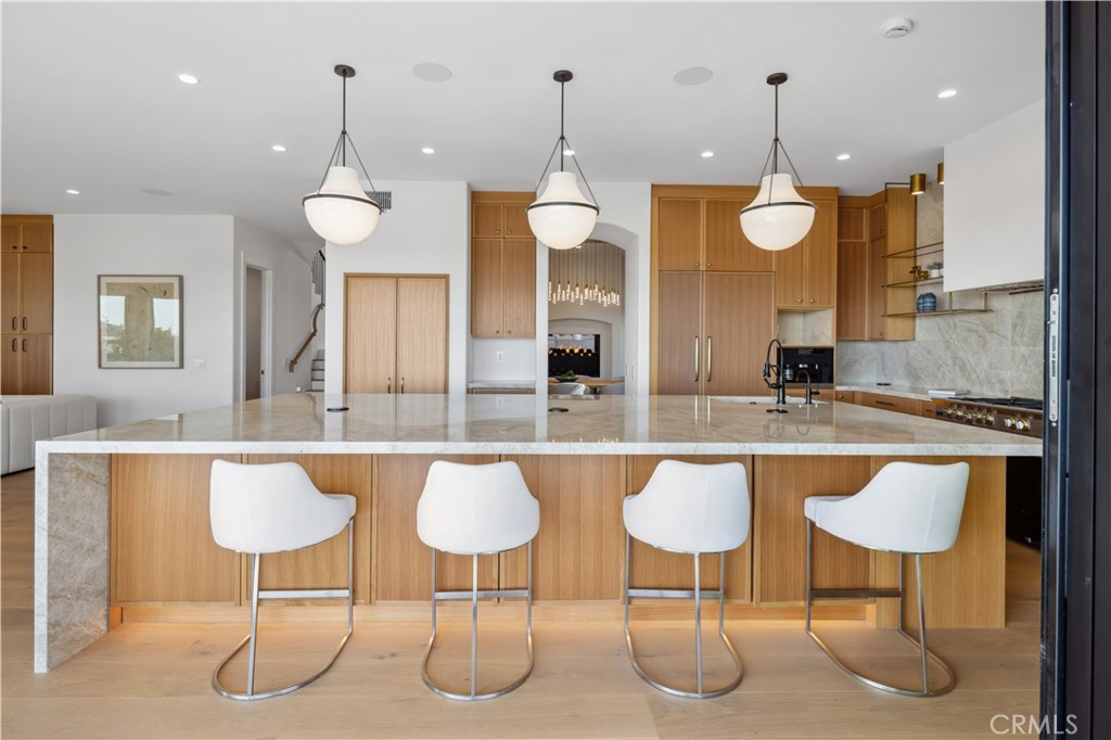 2915 Cliff Drive Newport Beach, CA 92663 - Photo 28 of 69 a kitchen with a dining table and chairs