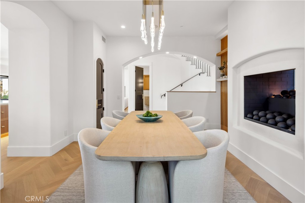 2915 Cliff Drive Newport Beach, CA 92663 - Photo 35 of 69 a view of a dining room with furniture and chandelier
