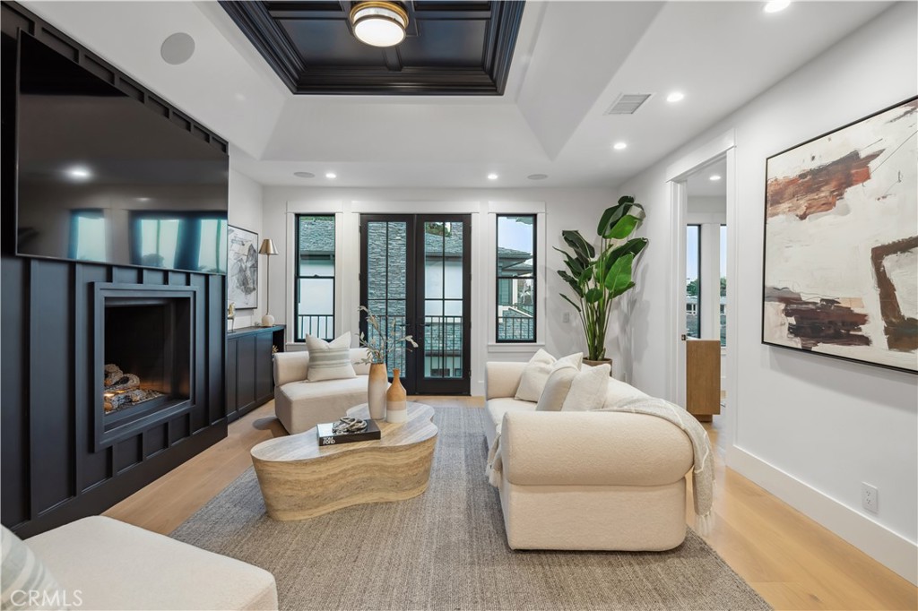 2915 Cliff Drive Newport Beach, CA 92663 - Photo 50 of 69 a living room with furniture a flat screen tv and a fireplace