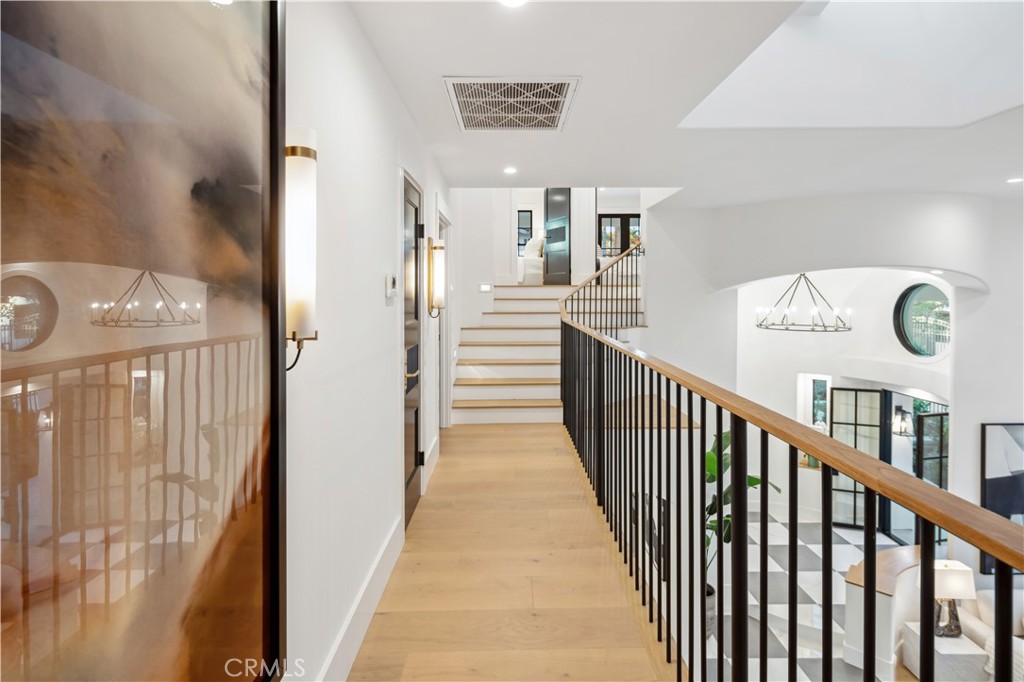 2915 Cliff Drive Newport Beach, CA 92663 - Photo 54 of 69 a view of a hallway with wooden floor and stairs