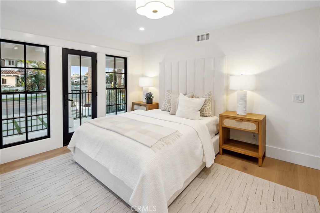 2915 Cliff Drive Newport Beach, CA 92663 - Photo 56 of 69 a bedroom with a large bed and a large window