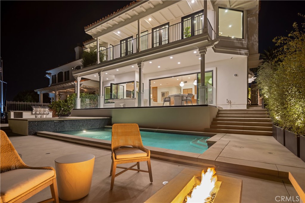 2915 Cliff Drive Newport Beach, CA 92663 - Photo 64 of 69 a balcony with table and chairs