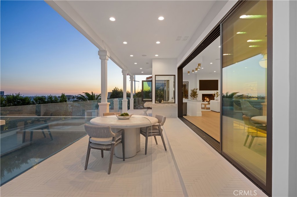 2915 Cliff Drive Newport Beach, CA 92663 - Photo 67 of 69 a dining area with a table and chairs