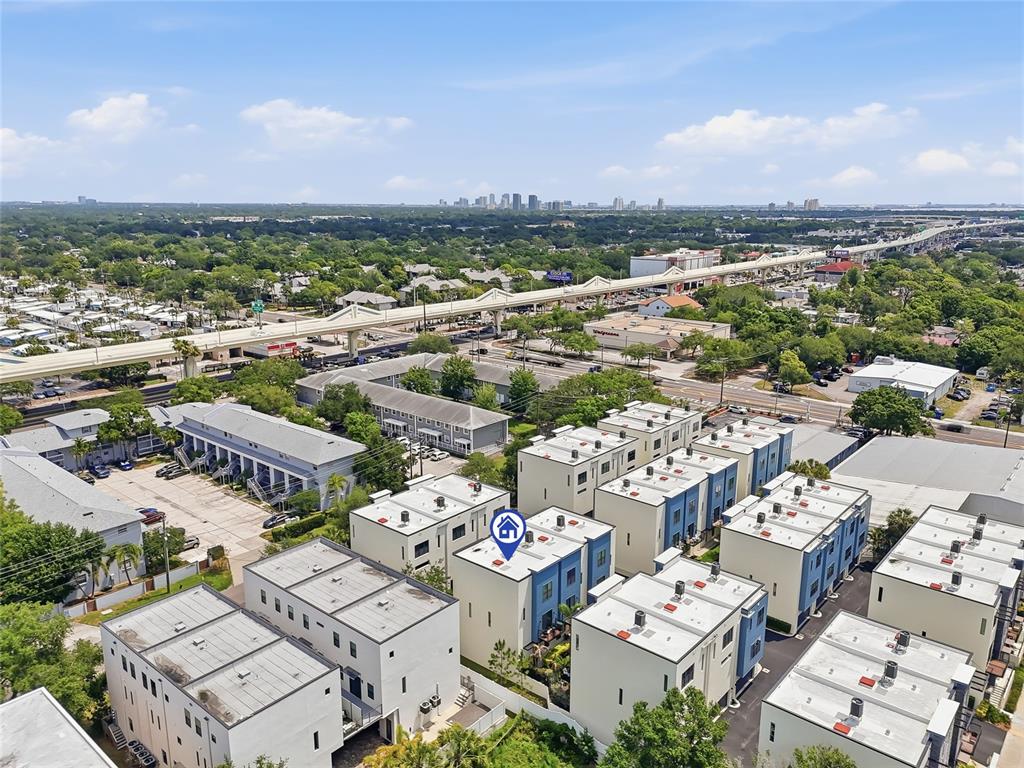 4810 West McElroy Avenue, Unit 30 Tampa, FL 33611 - Photo 38 of 43 an aerial view of a city with lots of residential buildings