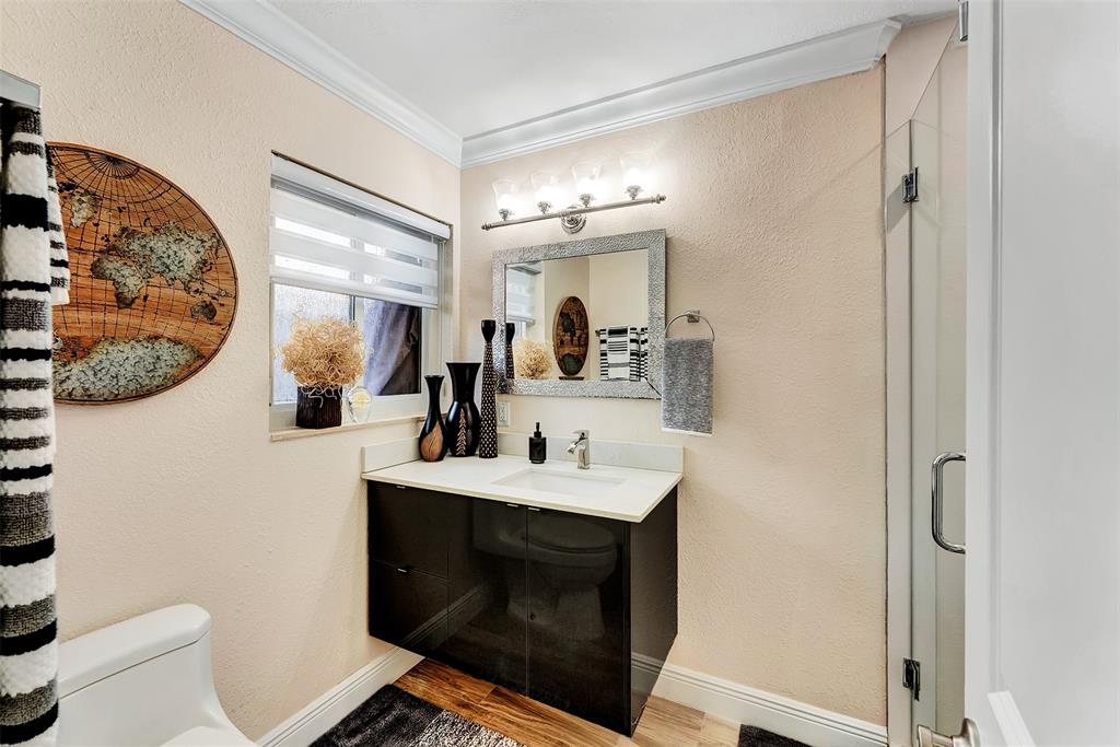 1500 Northeast 24th Street Wilton Manors, FL 33305 - Photo 26 of 88 a bathroom with a sink toilet and mirror
