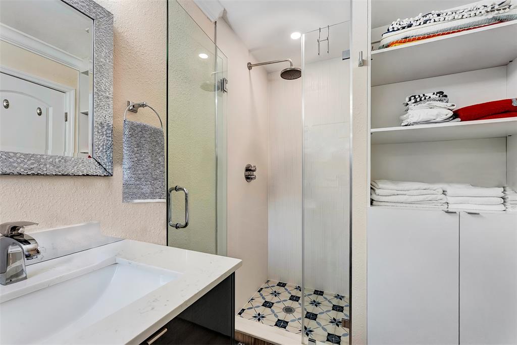 1500 Northeast 24th Street Wilton Manors, FL 33305 - Photo 28 of 88 a bathroom with a sink a toilet and shower