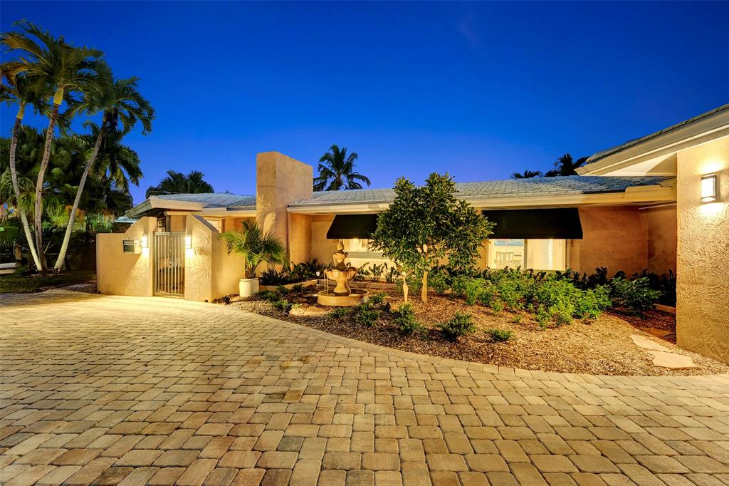 1500 Northeast 24th Street Wilton Manors, FL 33305 - Photo 3 of 88 a view of a house with backyard and sitting area
