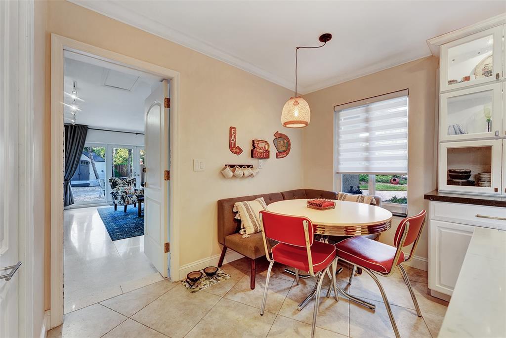 1500 Northeast 24th Street Wilton Manors, FL 33305 - Photo 31 of 88 a view of a dining room with furniture window and outside view