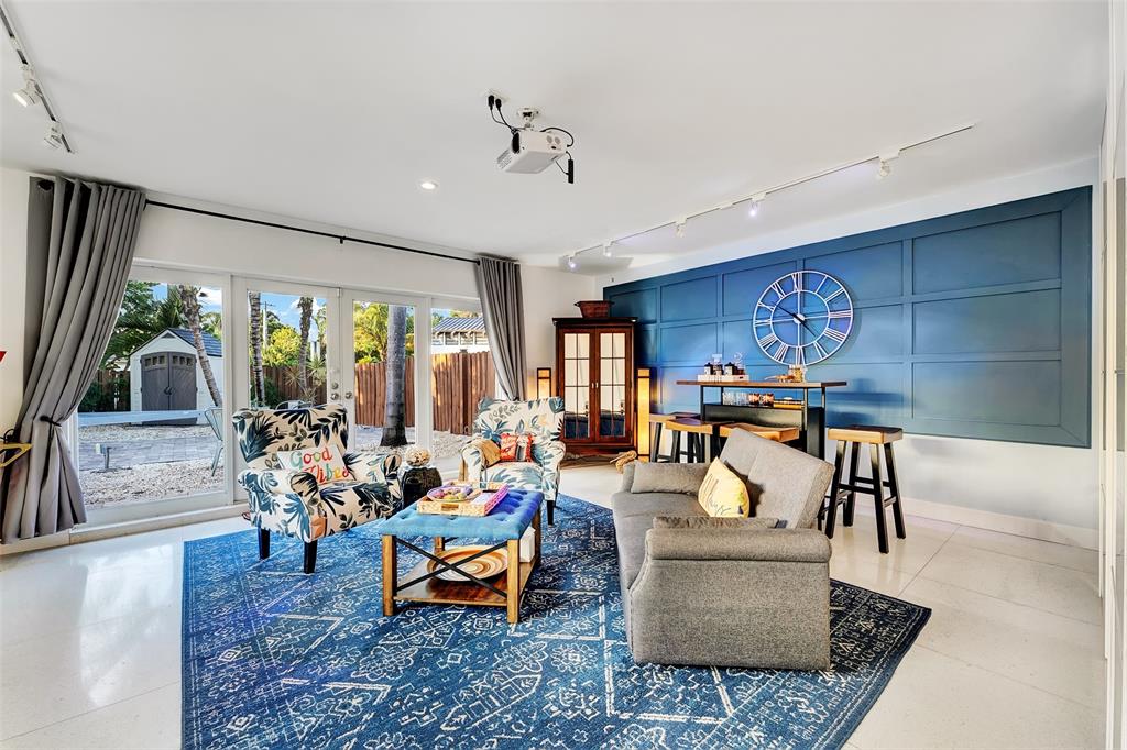 1500 Northeast 24th Street Wilton Manors, FL 33305 - Photo 38 of 88 a living room with furniture and a large window