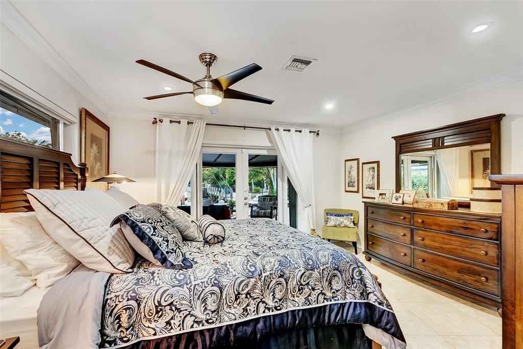 1500 Northeast 24th Street Wilton Manors, FL 33305 - Photo 49 of 88 a bed room with a bed and a large window