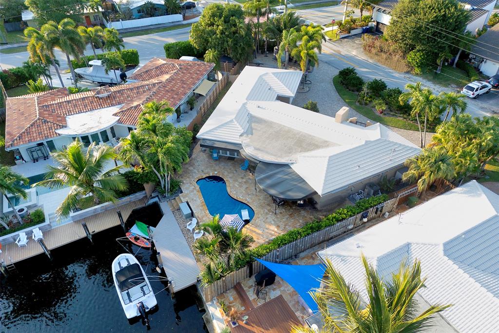 1500 Northeast 24th Street Wilton Manors, FL 33305 - Photo 5 of 88 an aerial view of a house with garden space and street view