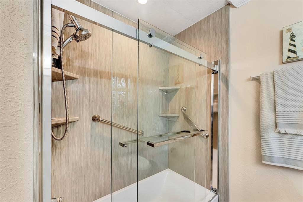 1500 Northeast 24th Street Wilton Manors, FL 33305 - Photo 51 of 88 a bathroom with a glass door shower and a sink