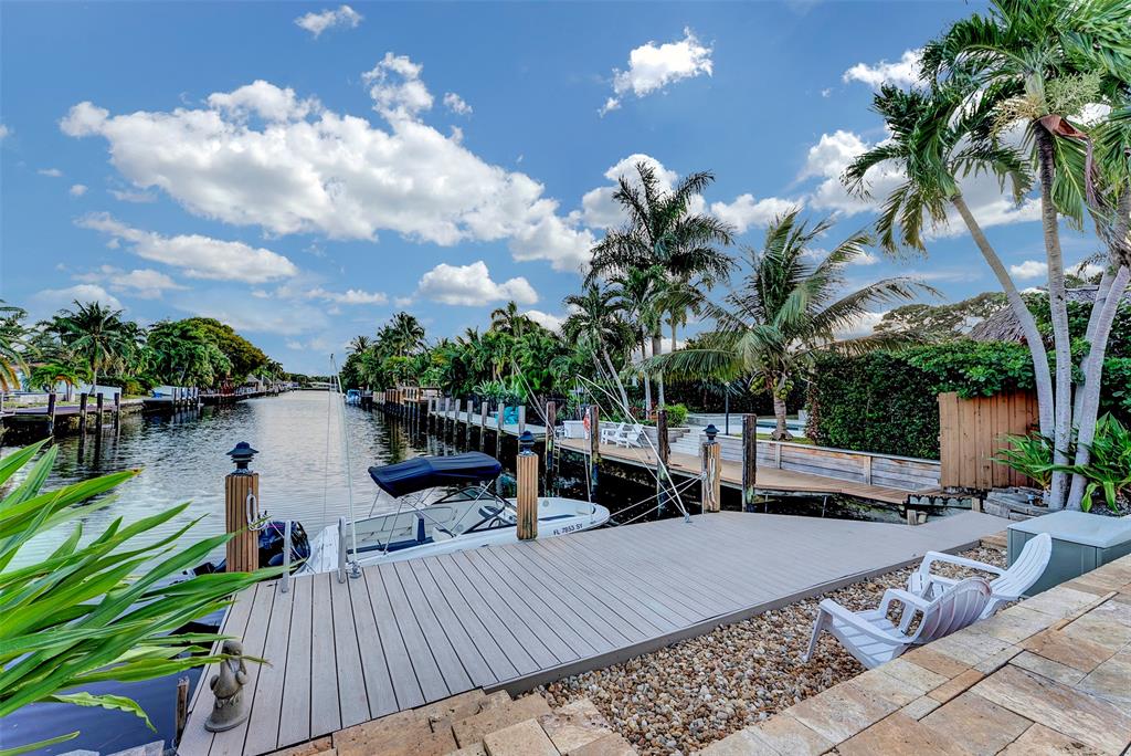 1500 Northeast 24th Street Wilton Manors, FL 33305 - Photo 53 of 88 a view of a swimming pool with a patio and a patio