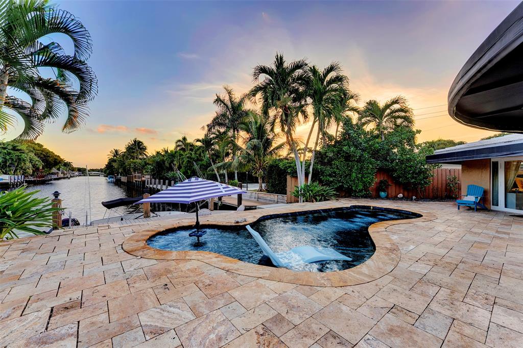 1500 Northeast 24th Street Wilton Manors, FL 33305 - Photo 60 of 88 a view of a swimming pool with a patio