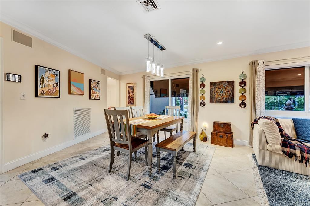 1500 Northeast 24th Street Wilton Manors, FL 33305 - Photo 66 of 88 a dining room with furniture and window