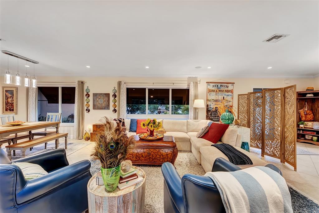 1500 Northeast 24th Street Wilton Manors, FL 33305 - Photo 68 of 88 a living room with furniture and a flat screen tv