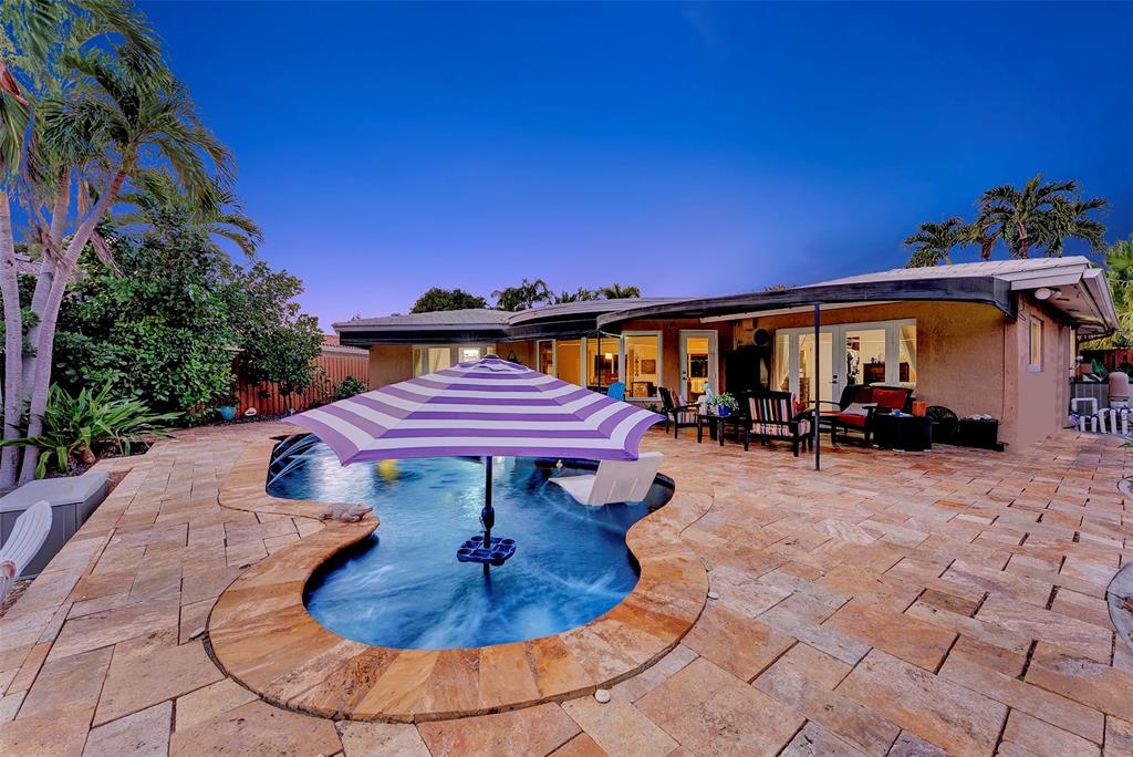 1500 Northeast 24th Street Wilton Manors, FL 33305 - Photo 82 of 88 a view of a swimming pool with a patio