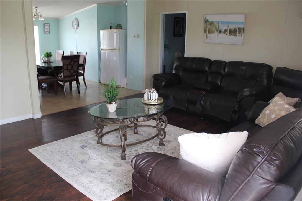 13127 Star Road Brooksville, FL 34613 - Photo 7 of 54 a living room with furniture and wooden floor