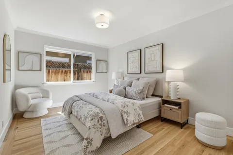 a bedroom with a bed and a couch