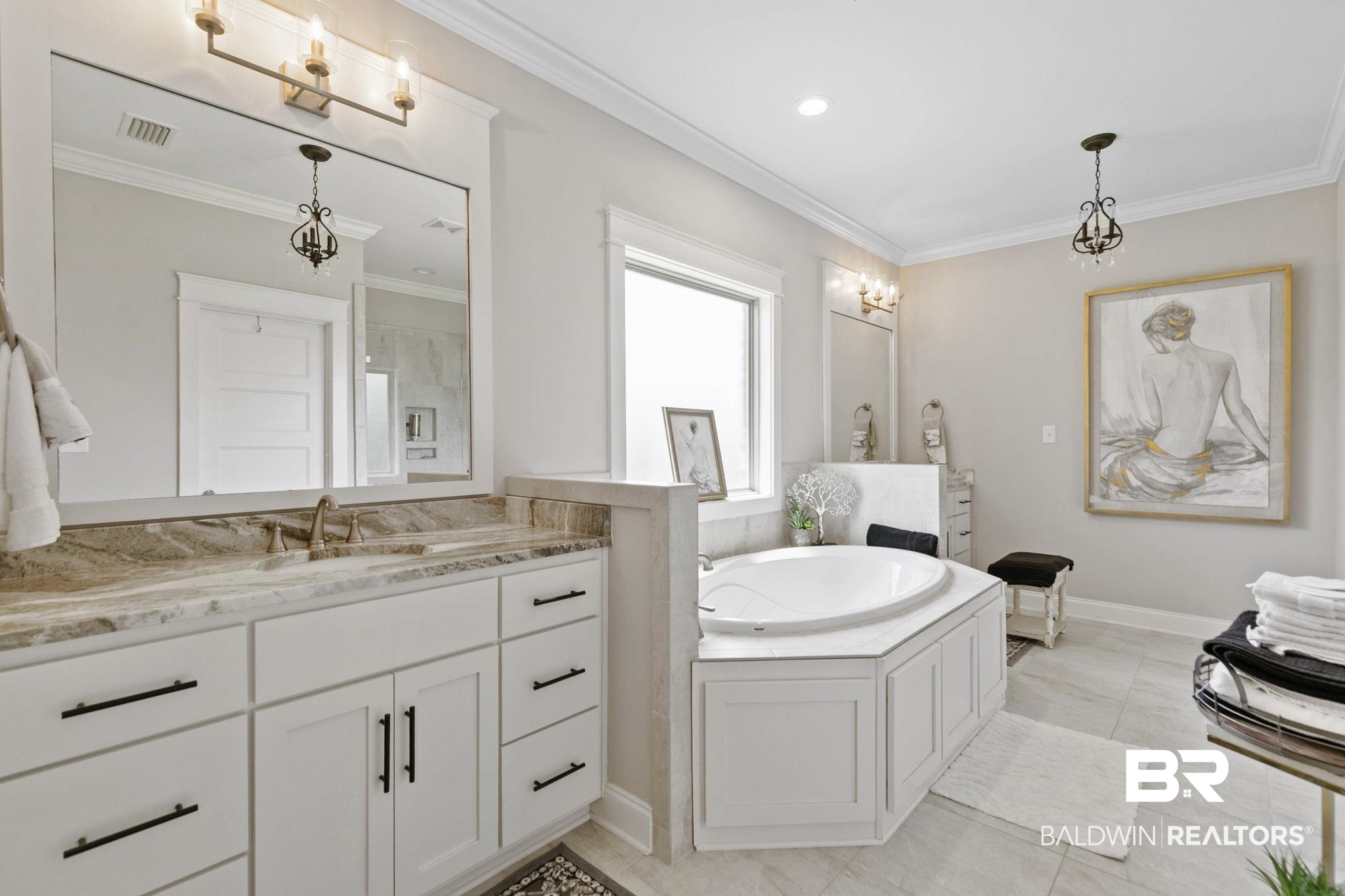291 Hemlock Drive Fairhope, AL 36532 - Photo 31 of 65 Bathroom with ornamental molding, a garden tub, two vanities, suspended lighting, and light tile patterned floors
