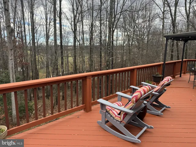 a view of a chairs in wooden deck