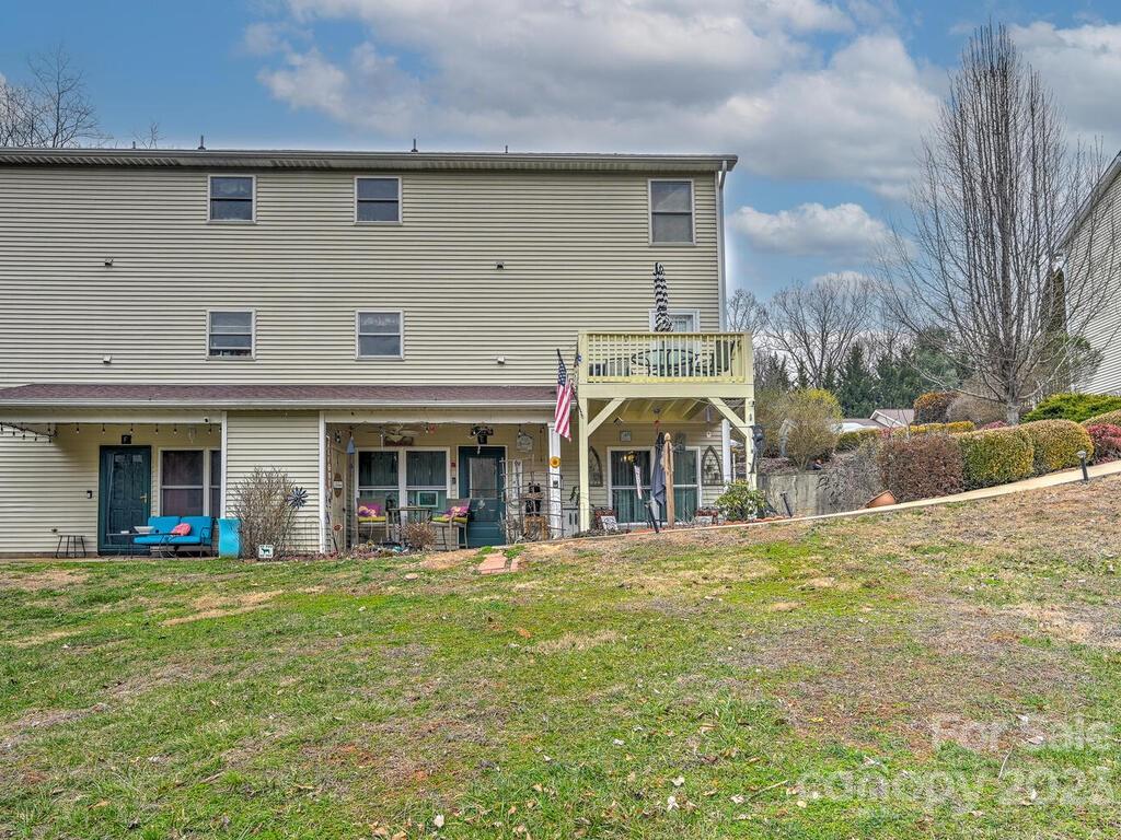 19 Krista Circle, Unit E Candler, NC 28715 - Photo 20 of 23 a front view of a house with a yard