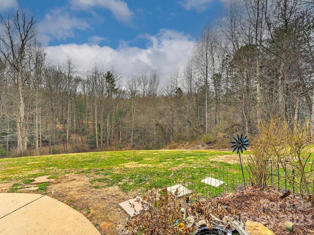 19 Krista Circle, Unit E Candler, NC 28715 - Photo 21 of 23 a view of swimming pool with a yard