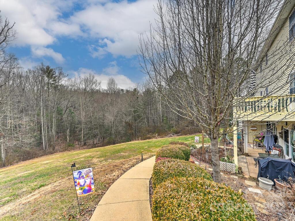 19 Krista Circle, Unit E Candler, NC 28715 - Photo 22 of 23 a view of swimming pool with a patio