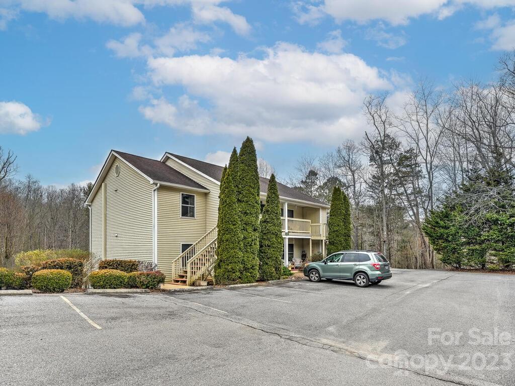19 Krista Circle, Unit E Candler, NC 28715 - Photo 23 of 23 a car parked in front of a house