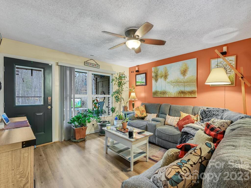 19 Krista Circle, Unit E Candler, NC 28715 - Photo 4 of 23 a living room with furniture and a large window