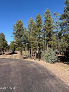 a view of a road with a building in the background