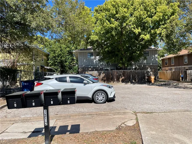 a view of a street with cars