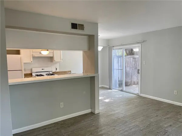 a view of a kitchen with a sink and a window