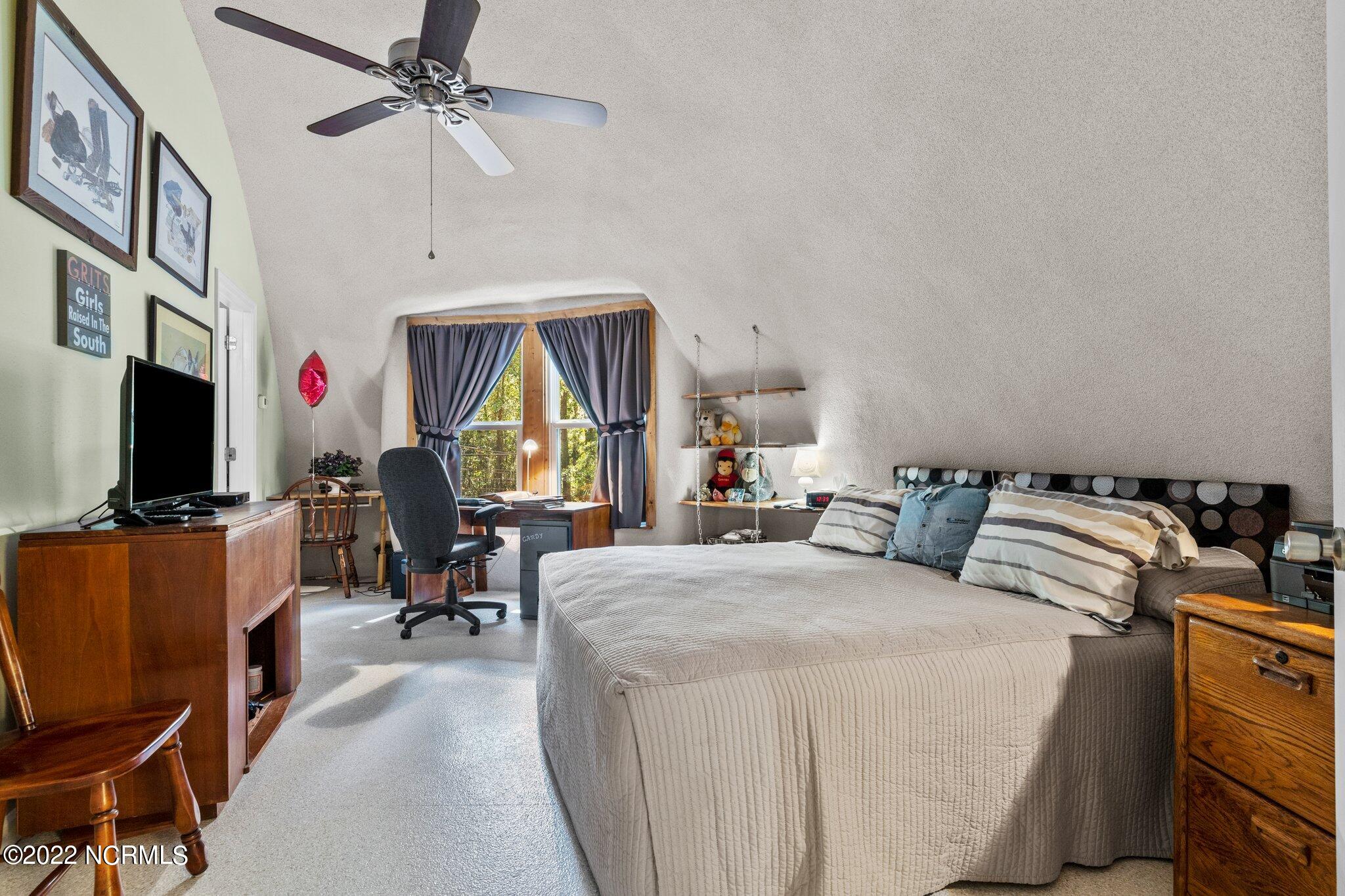 120 Pinebluff Lake Road Pinebluff, NC 28373 - Photo 13 of 40 Owner's bedroom has 2 built in workstations/desks.