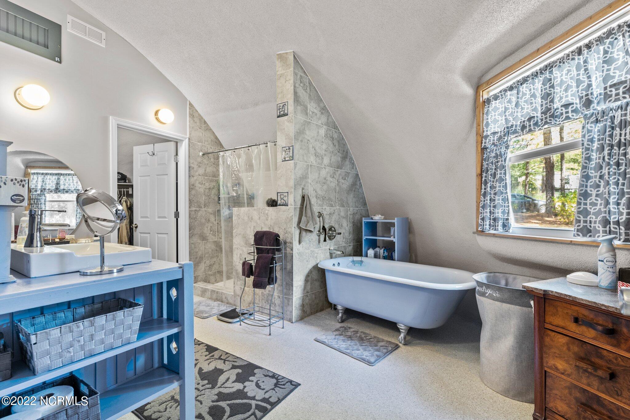 120 Pinebluff Lake Road Pinebluff, NC 28373 - Photo 16 of 40 Owner's bathroom with claw foot tub.