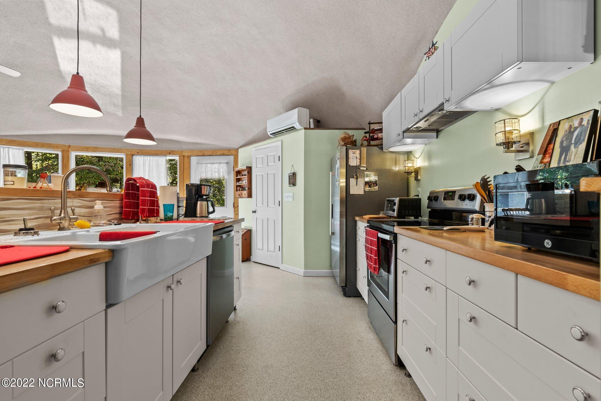 120 Pinebluff Lake Road Pinebluff, NC 28373 - Photo 22 of 40 Kitchen with pantry in background. The mini-split for the center dome is above the pantry.