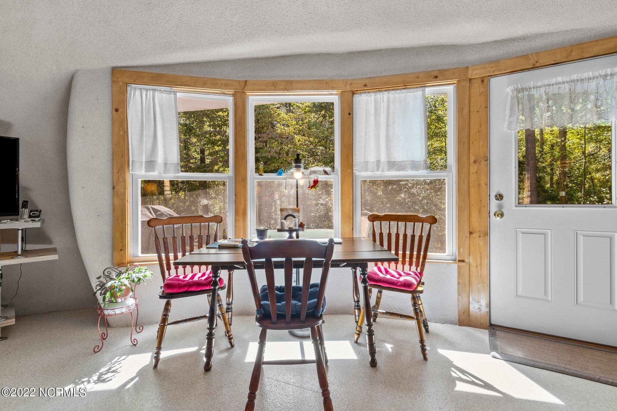 120 Pinebluff Lake Road Pinebluff, NC 28373 - Photo 27 of 40 Dining area looks out to back yard wildlife.