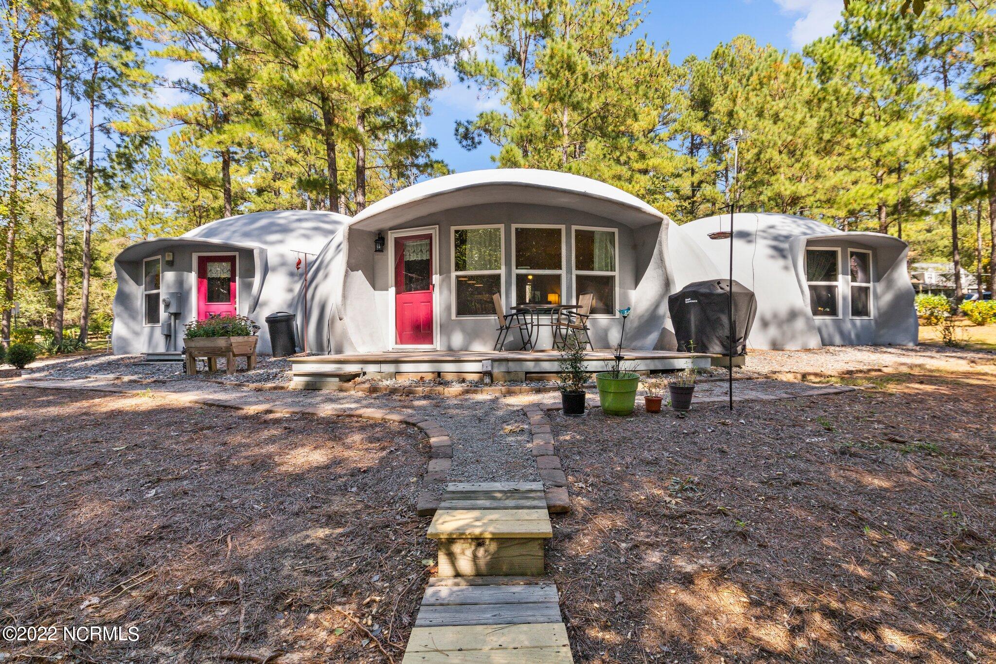120 Pinebluff Lake Road Pinebluff, NC 28373 - Photo 3 of 40 Back of home has many windows to let natural light flood the interior.
