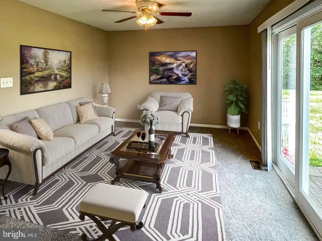 a living room with furniture and a window