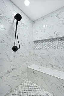 a vase of flowers on a granite counter top