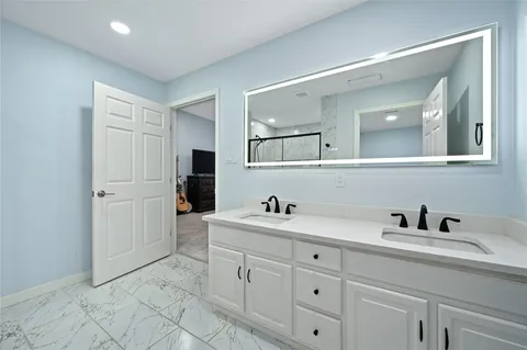 a bedroom with a bed and a tv