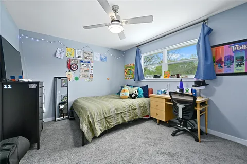 a bathroom with a toilet sink and shower