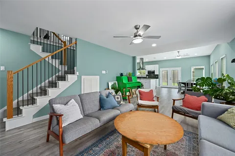 a living room with furniture and a potted plant
