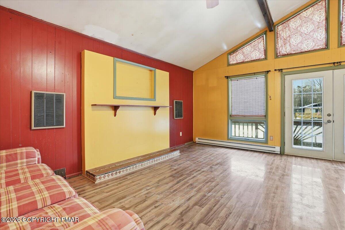 401 Clearview Drive Long Pond, PA 18334 - Photo 11 of 77 a view of an empty room with wooden floor and a window