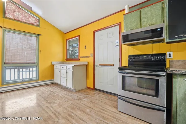 a kitchen with stainless steel appliances granite countertop a stove and a sink