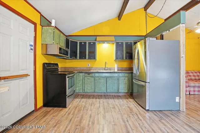 a bathroom with a sink a mirror and a shower