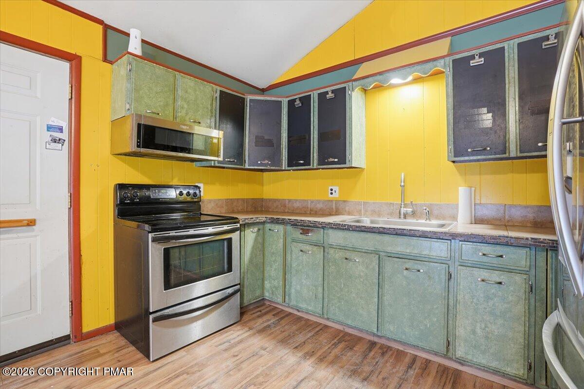 401 Clearview Drive Long Pond, PA 18334 - Photo 18 of 77 a kitchen with stainless steel appliances granite countertop a stove and a sink