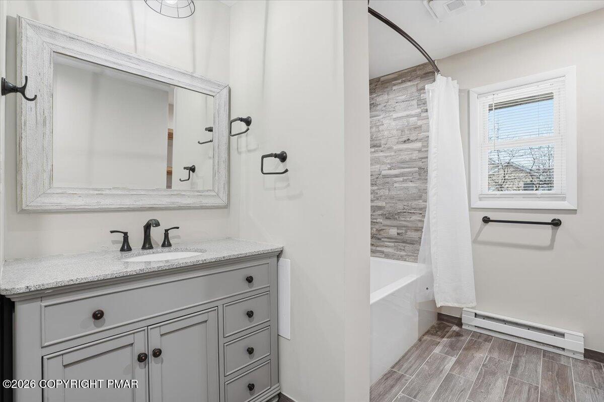 401 Clearview Drive Long Pond, PA 18334 - Photo 20 of 77 a bathroom with a sink a mirror and a shower