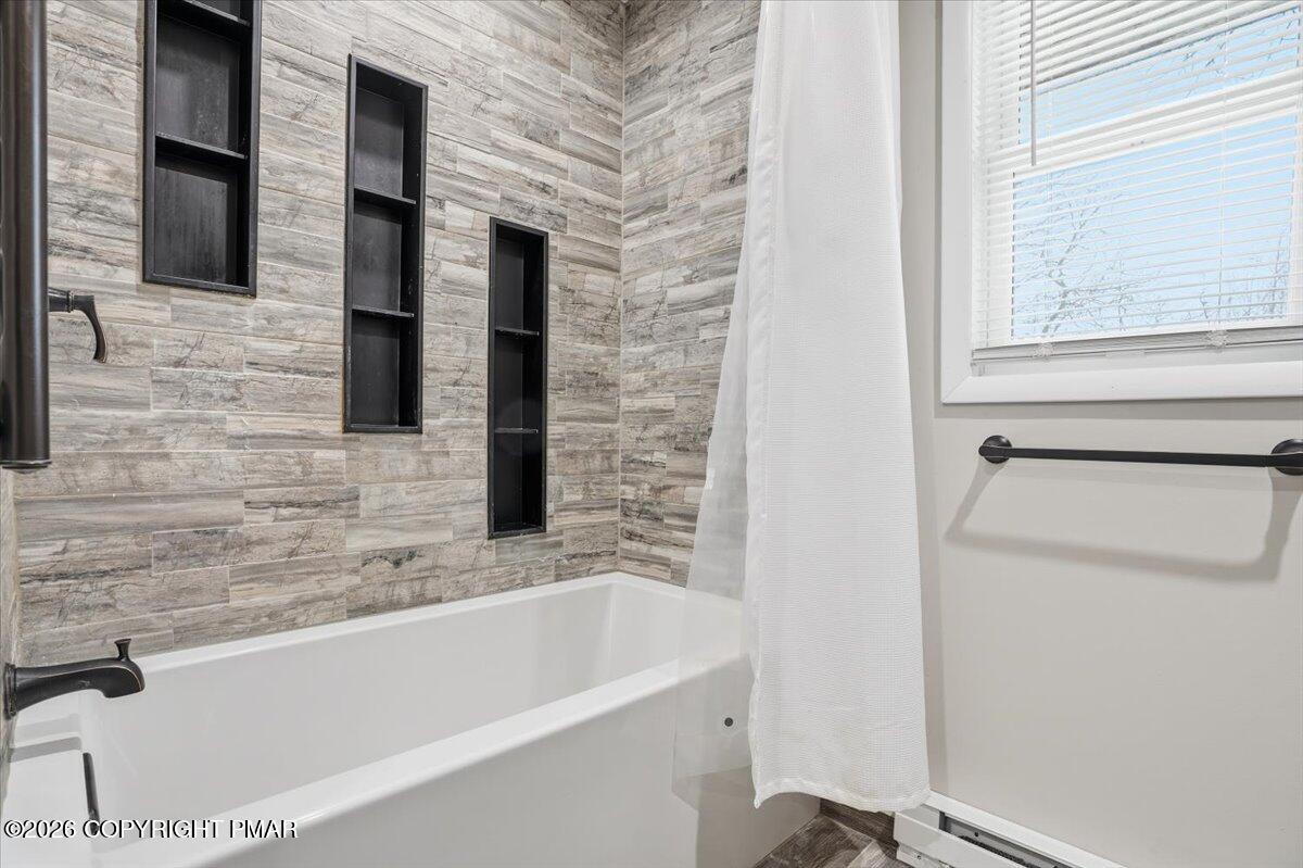 401 Clearview Drive Long Pond, PA 18334 - Photo 21 of 77 a bathroom with a bathtub and a window