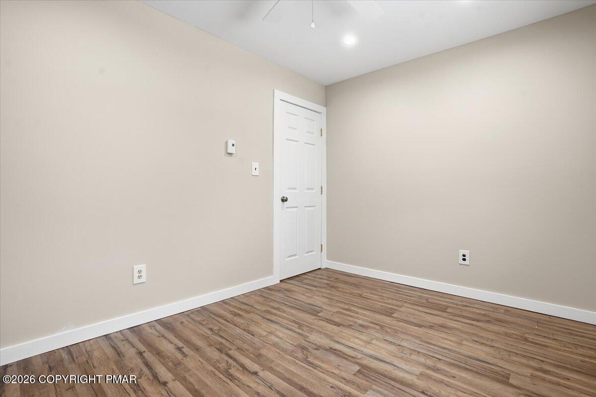 401 Clearview Drive Long Pond, PA 18334 - Photo 26 of 77 a view of an empty room with wooden floor